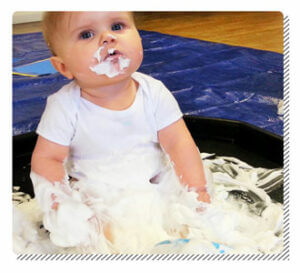 Baby Playing with Whipped Cream